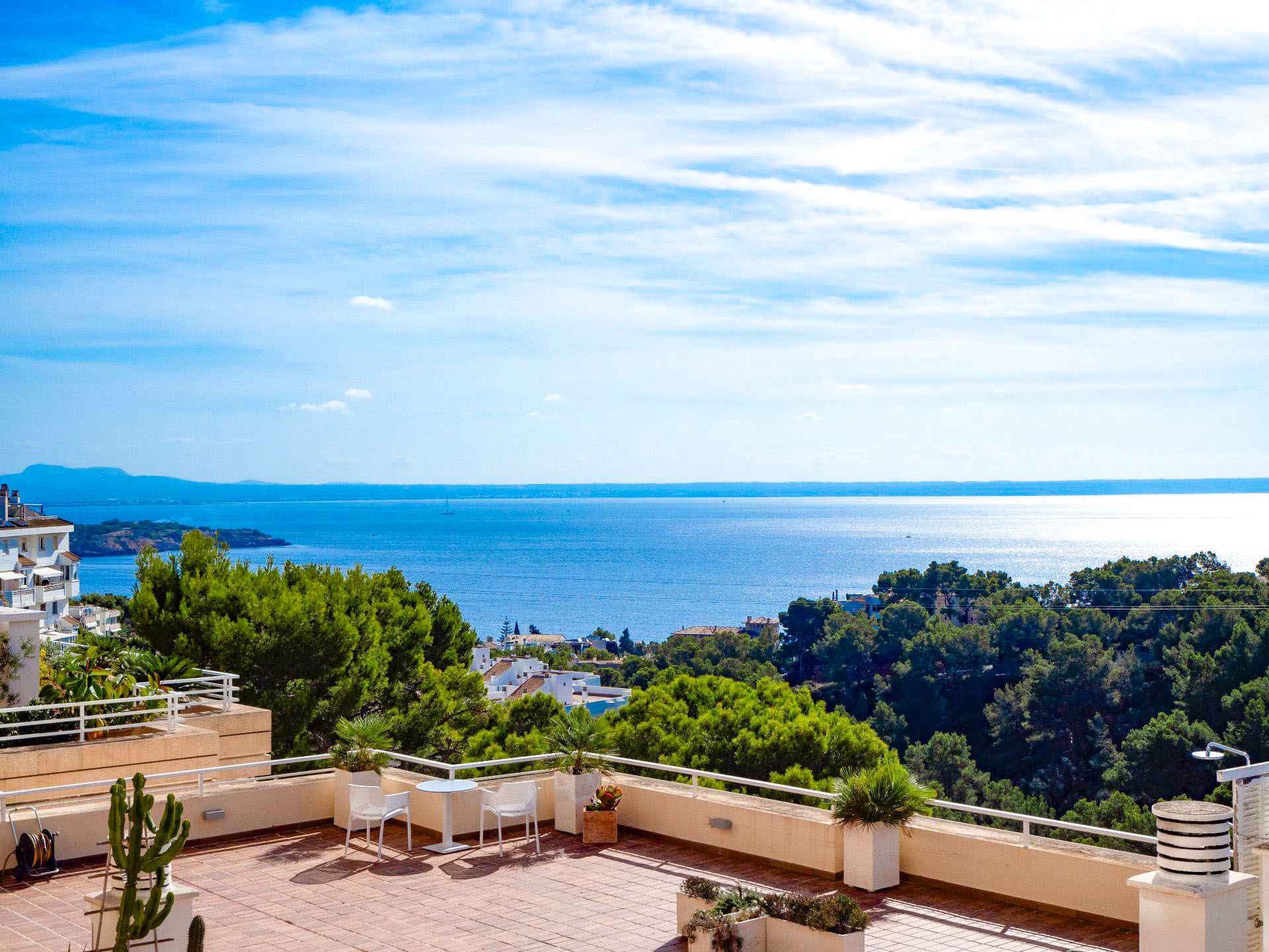 An image of a spacious sea view apartment in Cas Català, featuring a bright and open interior with large windows that showcase stunning views of the Mediterranean Sea. The apartment is designed with modern elegance, offering ample living space and a seamless flow between rooms. A private terrace extends from the living area, providing the perfect spot to enjoy the breathtaking coastal scenery. The tranquil atmosphere and stylish decor make this apartment an ideal retreat by the sea.