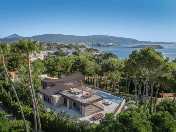 An image of a sea view project in Cap Falco, Cala Vinyes, highlighting a modern architectural design that takes full advantage of the stunning Mediterranean views. The property is set in a prime location, offering expansive floor-to-ceiling windows to capture panoramic vistas of the sea and surrounding landscape. The project features open-plan living areas, spacious terraces, and high-end finishes, designed for luxurious living. Outside, there are planned spaces for a private pool, gardens, and relaxing outdoor areas, providing the perfect coastal retreat in this exclusive area.