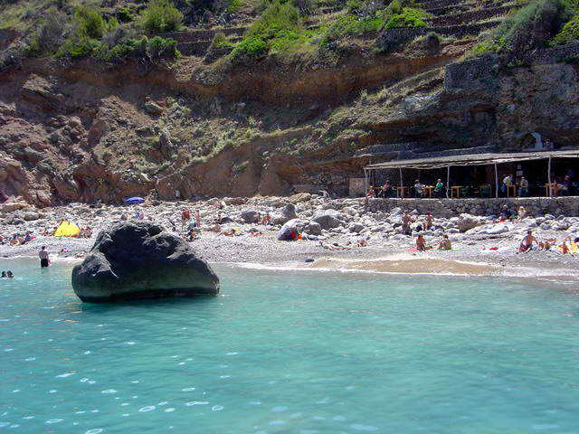 Rocky shoreline and turquoise water at Cala Deià