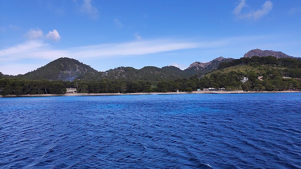 Formentor beach and pine-covered hills seen from the sea